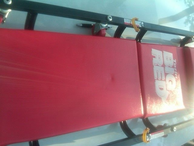 Big Red Shop Creeper with Fold Up Headrest and Caster Wheels