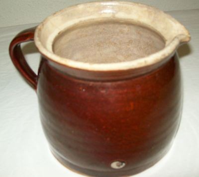 OLD BROWN CROCK PITCHER PRESSED ON HANDLE