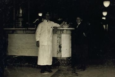 1914 child labor photo 2 table boys in Moore Drug store. Location 