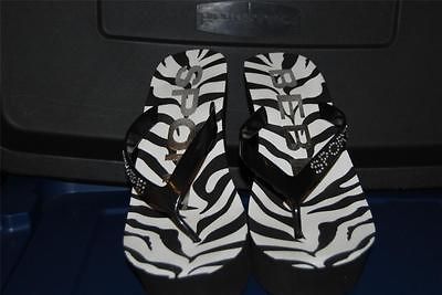 BEBE NWOT SANDELS BLACK WHITE ZEBRA WITH BEBE IN RHINESTONES RUBBER 