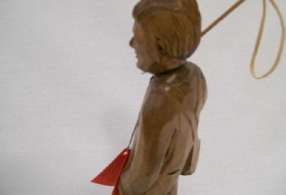 Old stock. Quebec carver signed Caron   Young man with fishing rod.