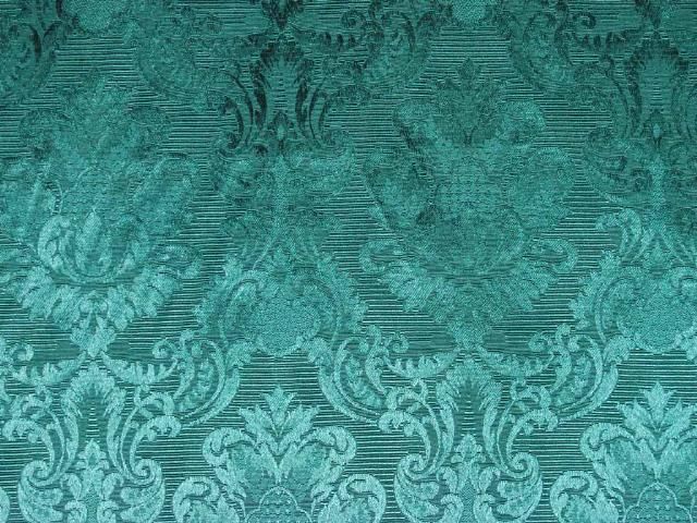  is a traditional damask upholstery fabric in green the green color is