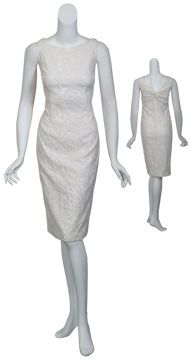 Feminine ivory matelasse cocktail dress with back knot v neckline