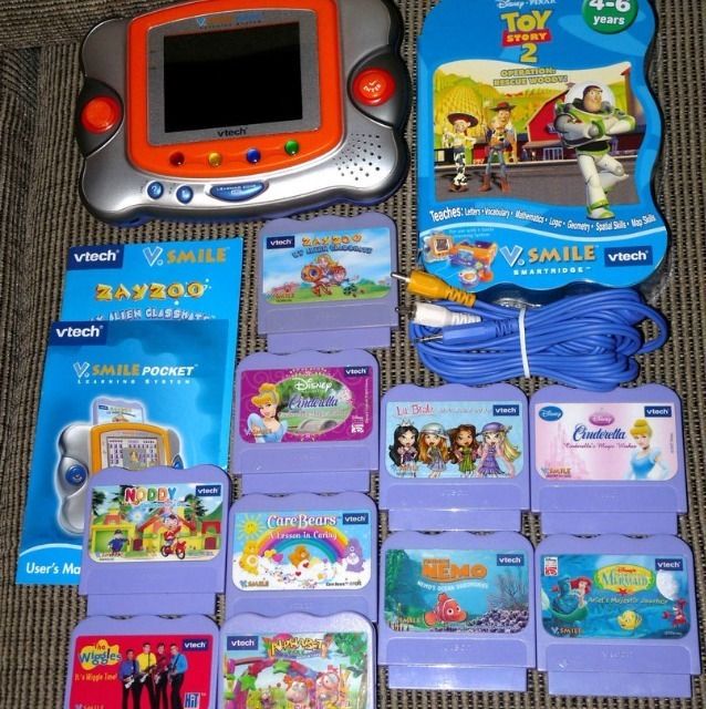 Vtech Vsmile Pocket learing game w/11 games books t.v. plug disney