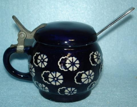  mustard pot in a deep cobalt color with gray interior has a metal